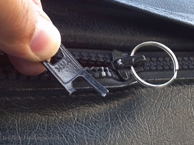 What are the steps to repair a zipper when its slider has come off?